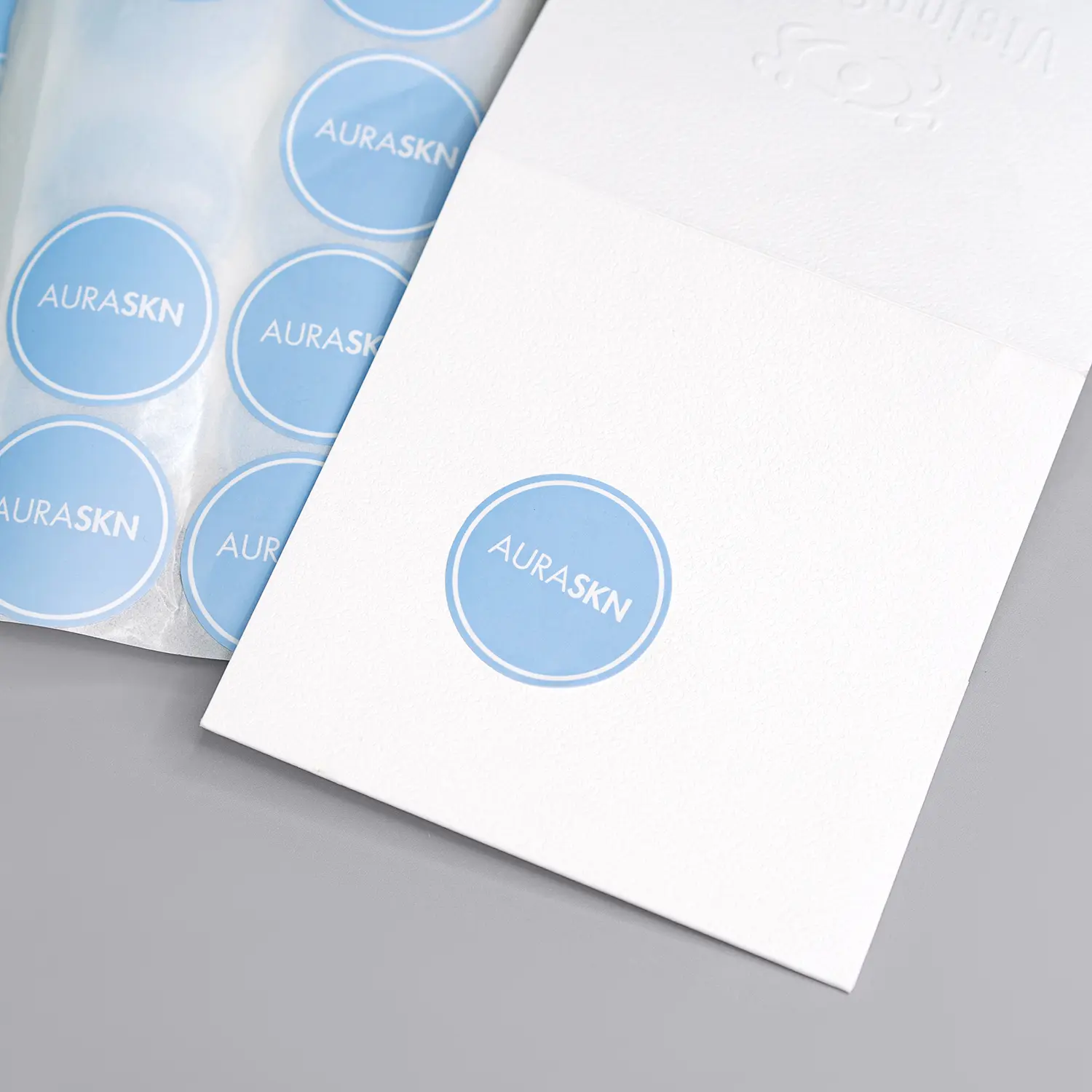 Round blue brand logo sticker label for gift packaging