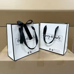 Customized logo luxury white shopping paper bag with ribbon