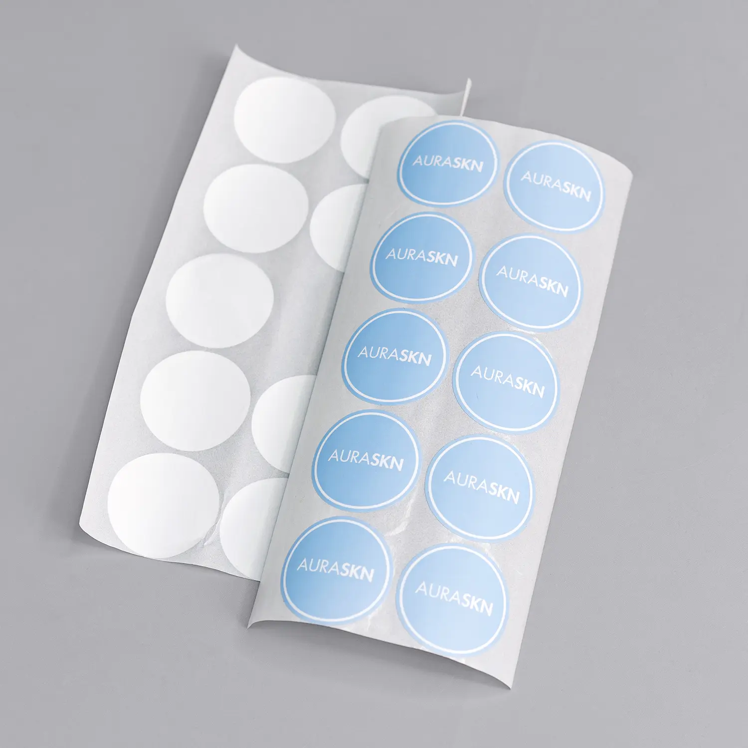 Round blue brand logo sticker label for gift packaging