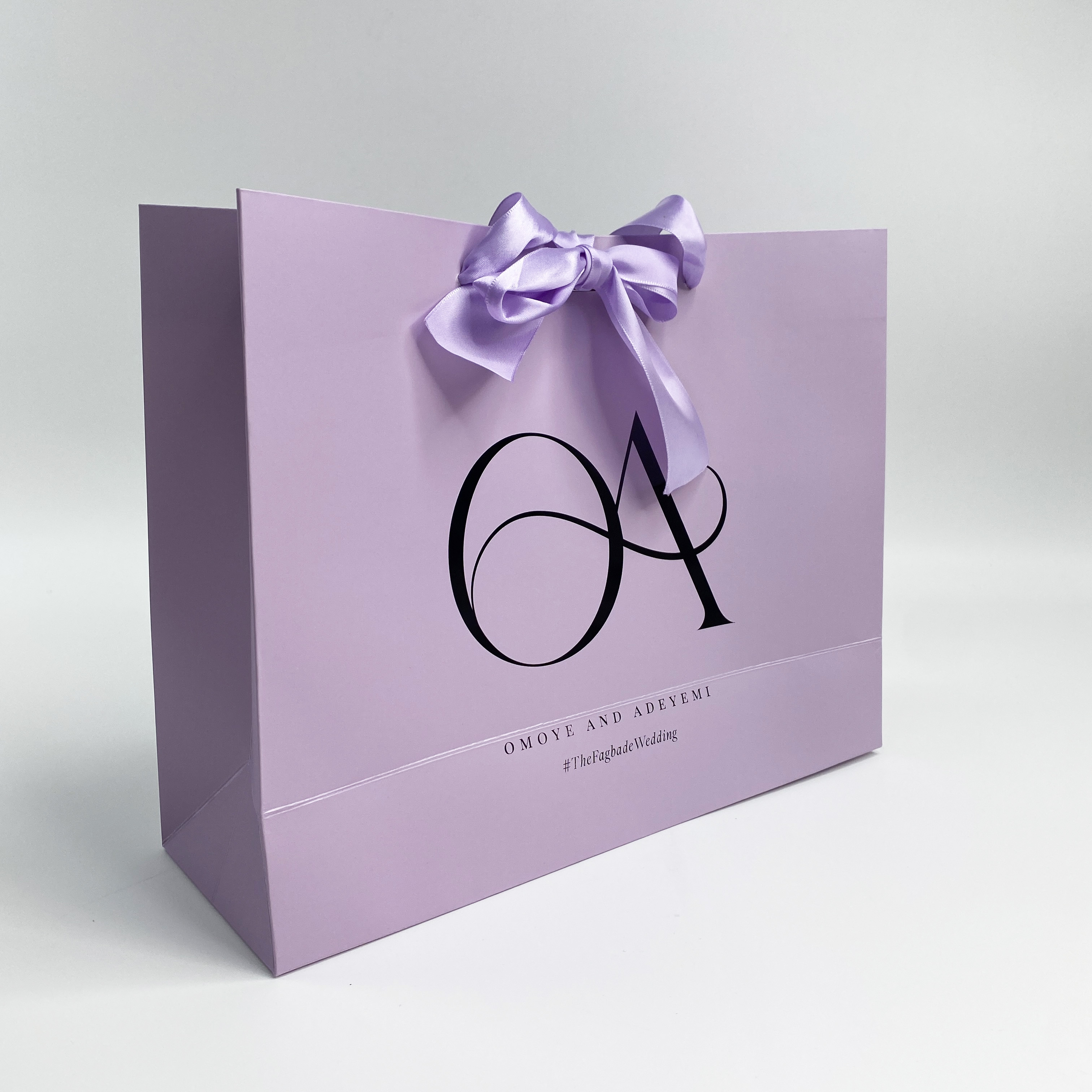 Purple paper shopping bag with custom logo printed