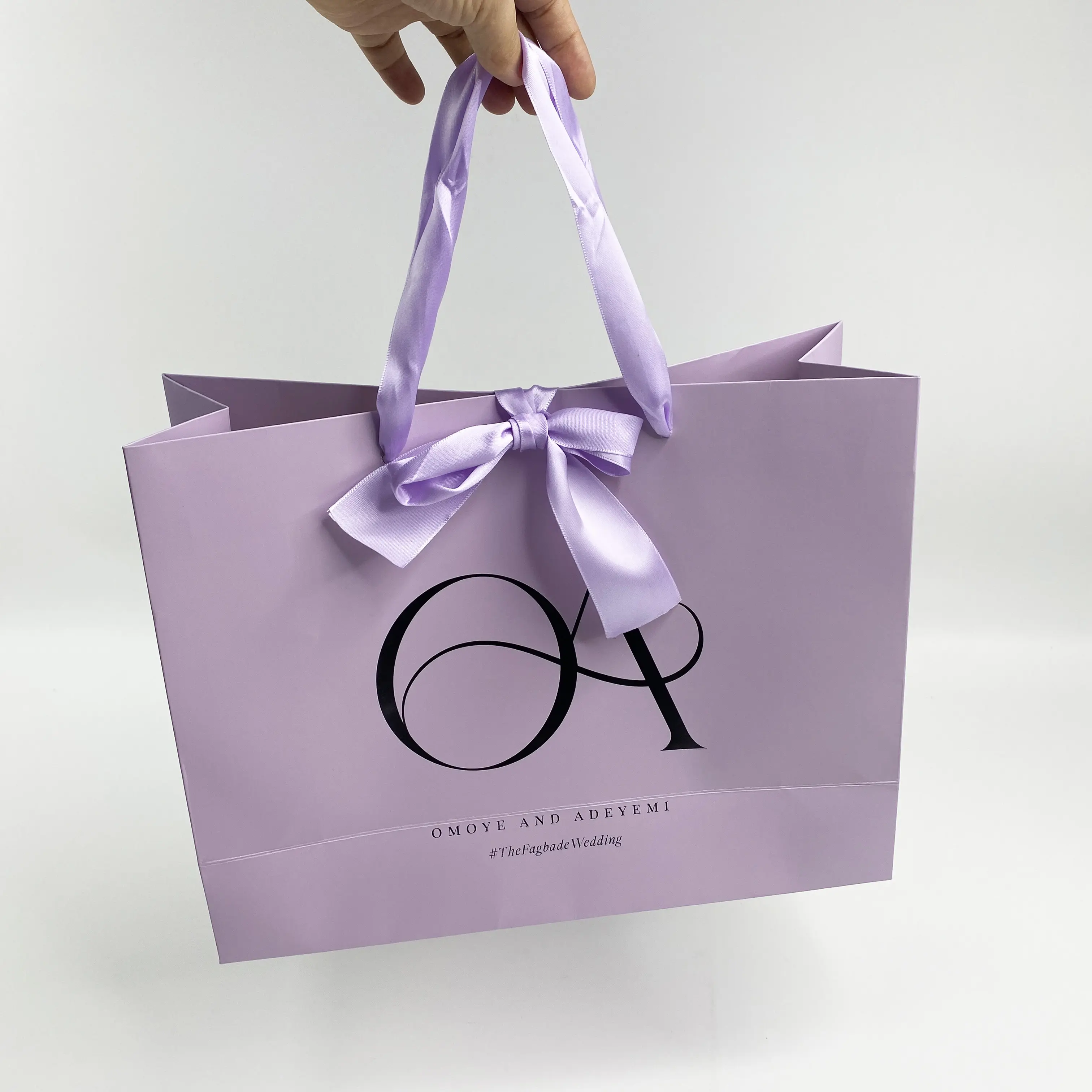 Purple paper shopping bag with custom logo printed