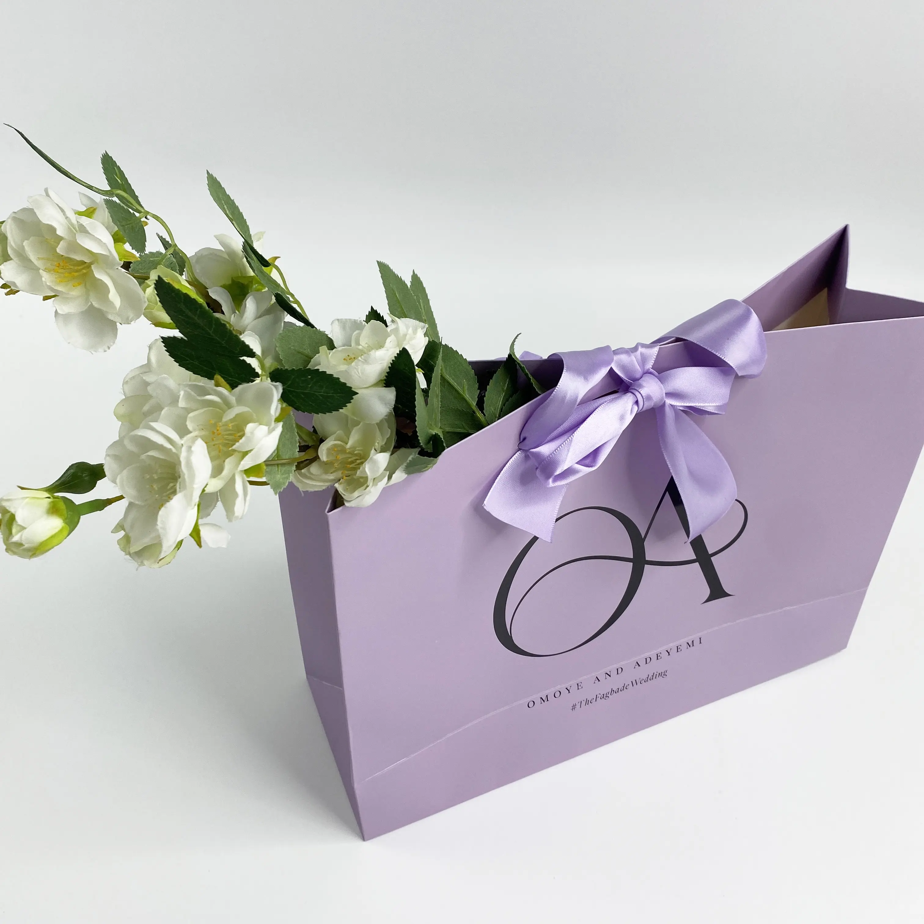 Purple paper shopping bag with custom logo printed