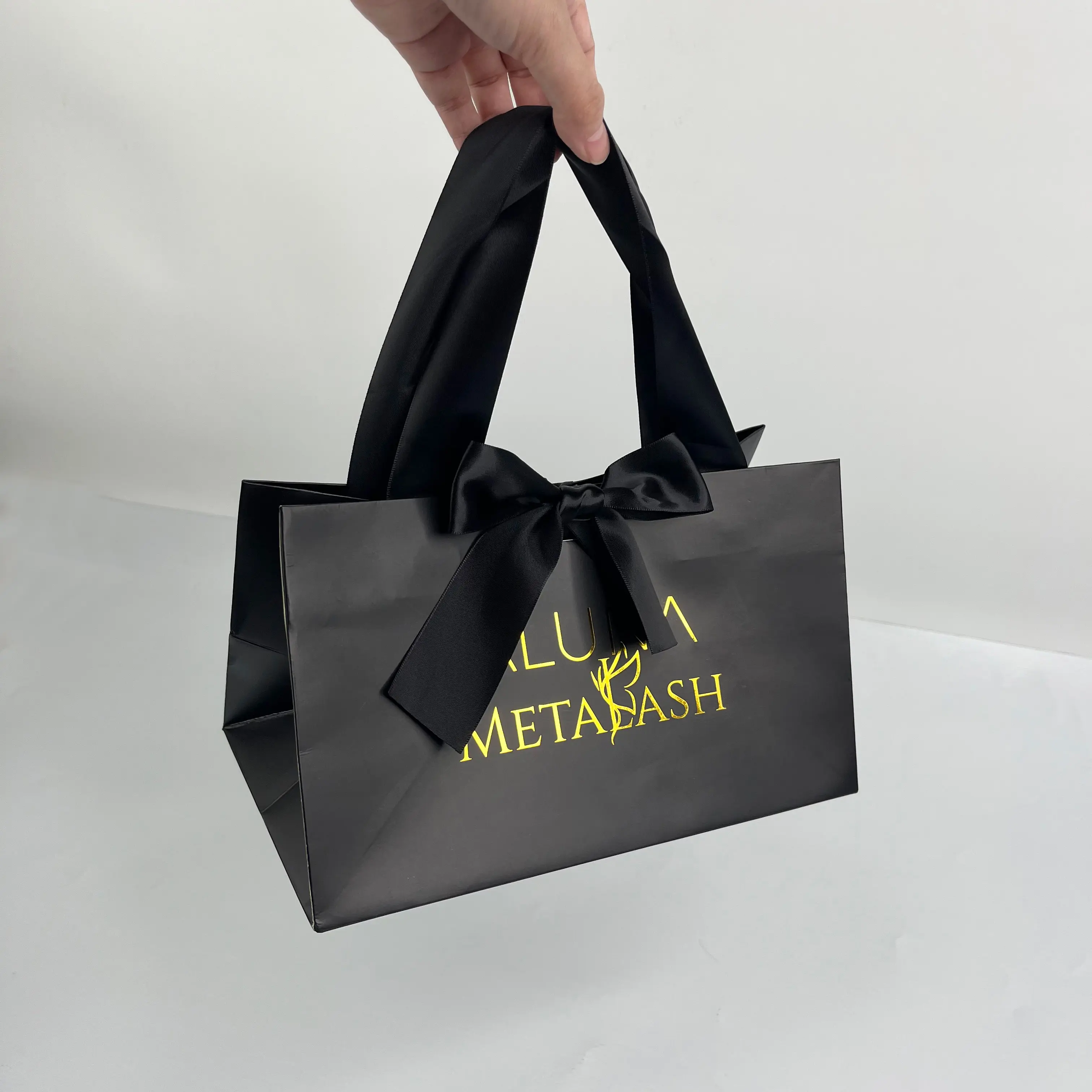 Custom luxury black paper bag with gold foil logo printed