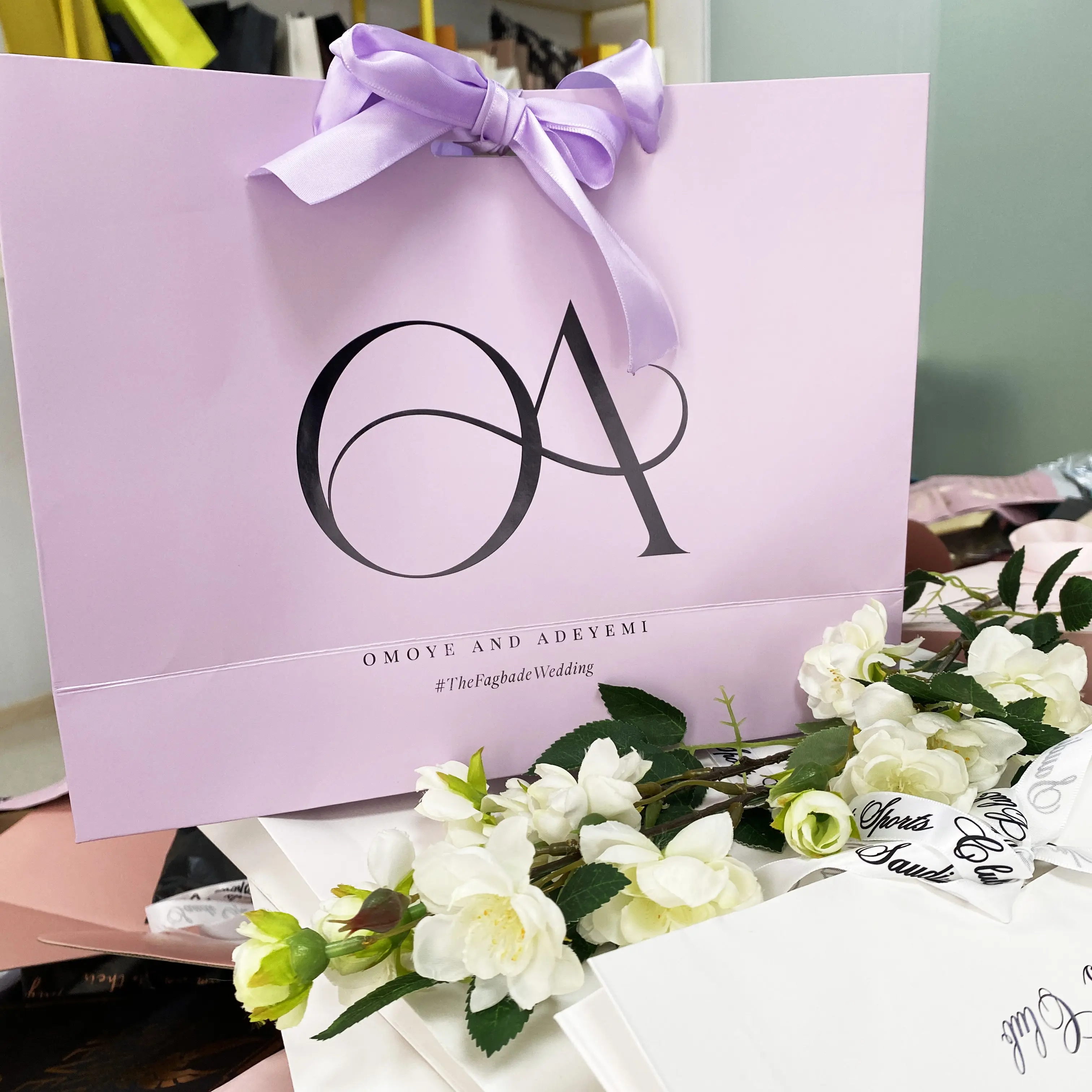 Purple paper shopping bag with custom logo printed
