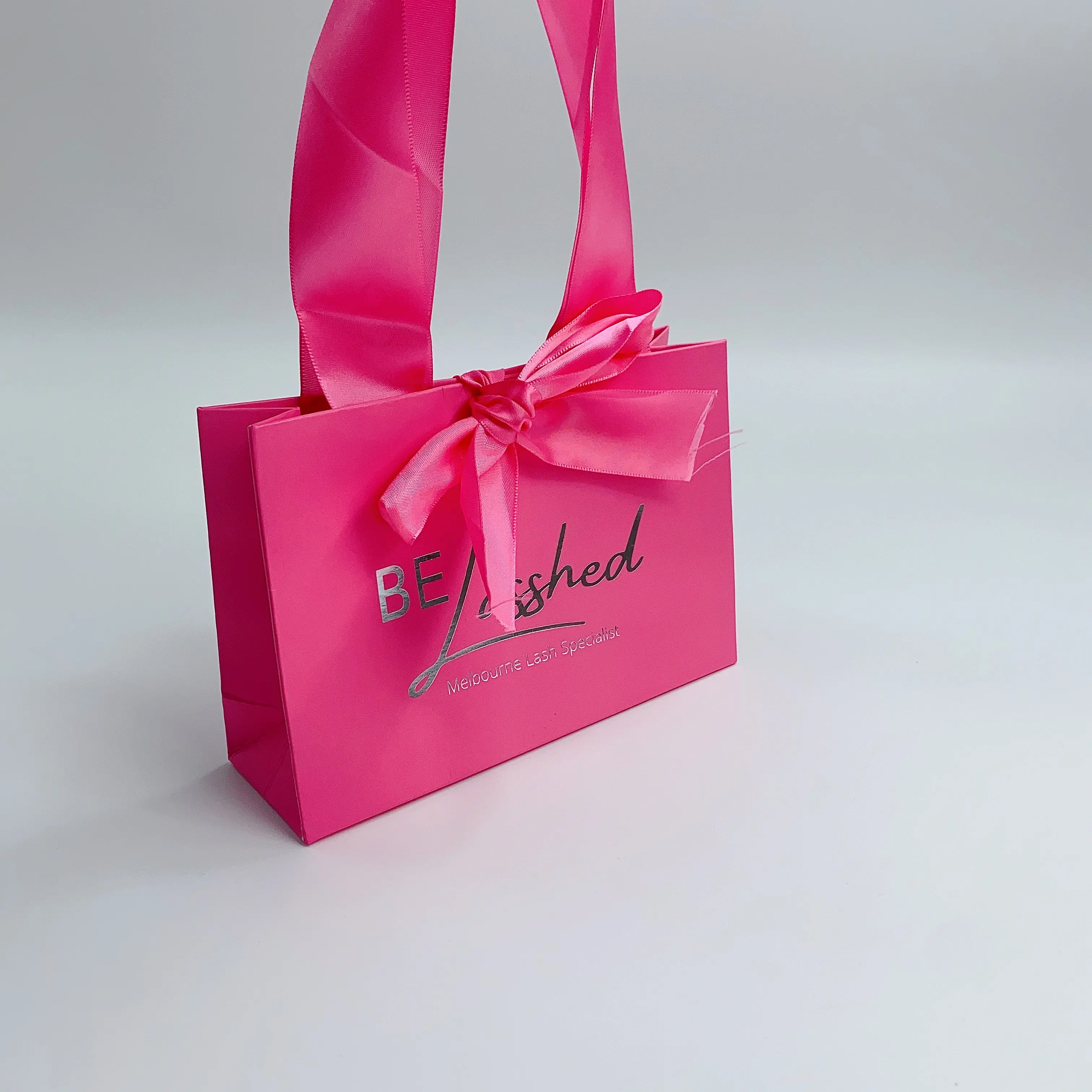 Customized logo hot pink cosmetics shopping paper bag