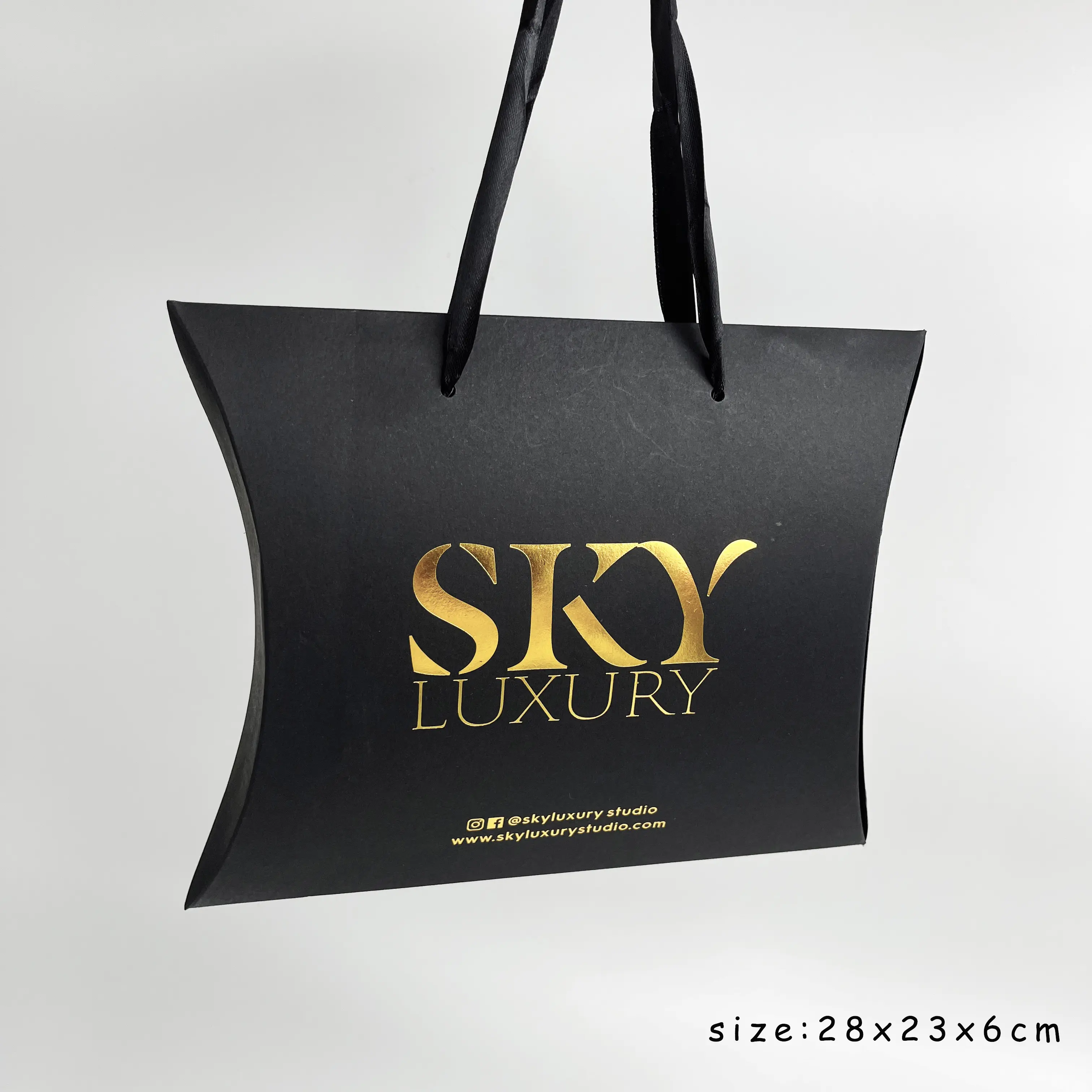 Luxury folding black paper bag with custom logo