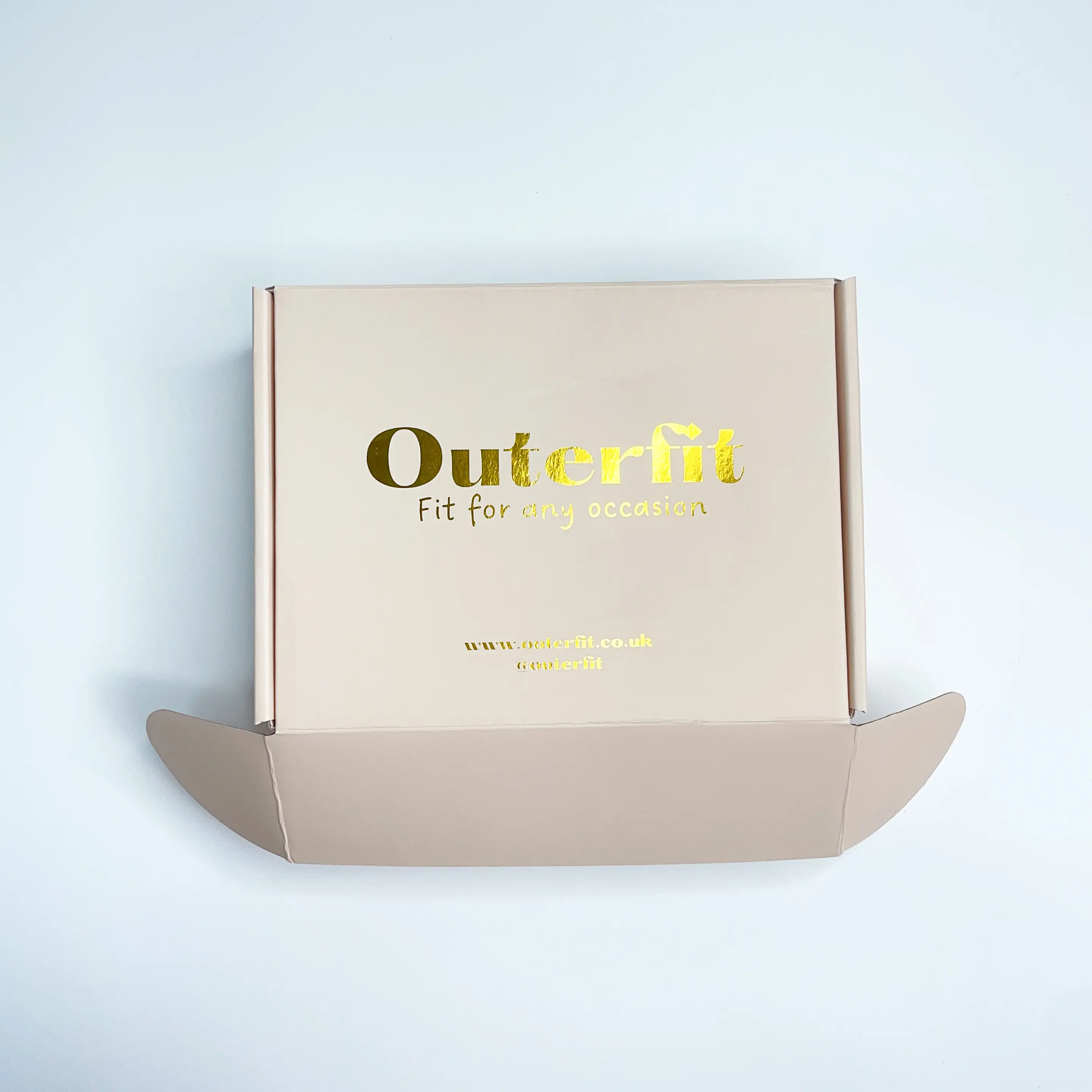 Peach paper mailer box with gold foil logo