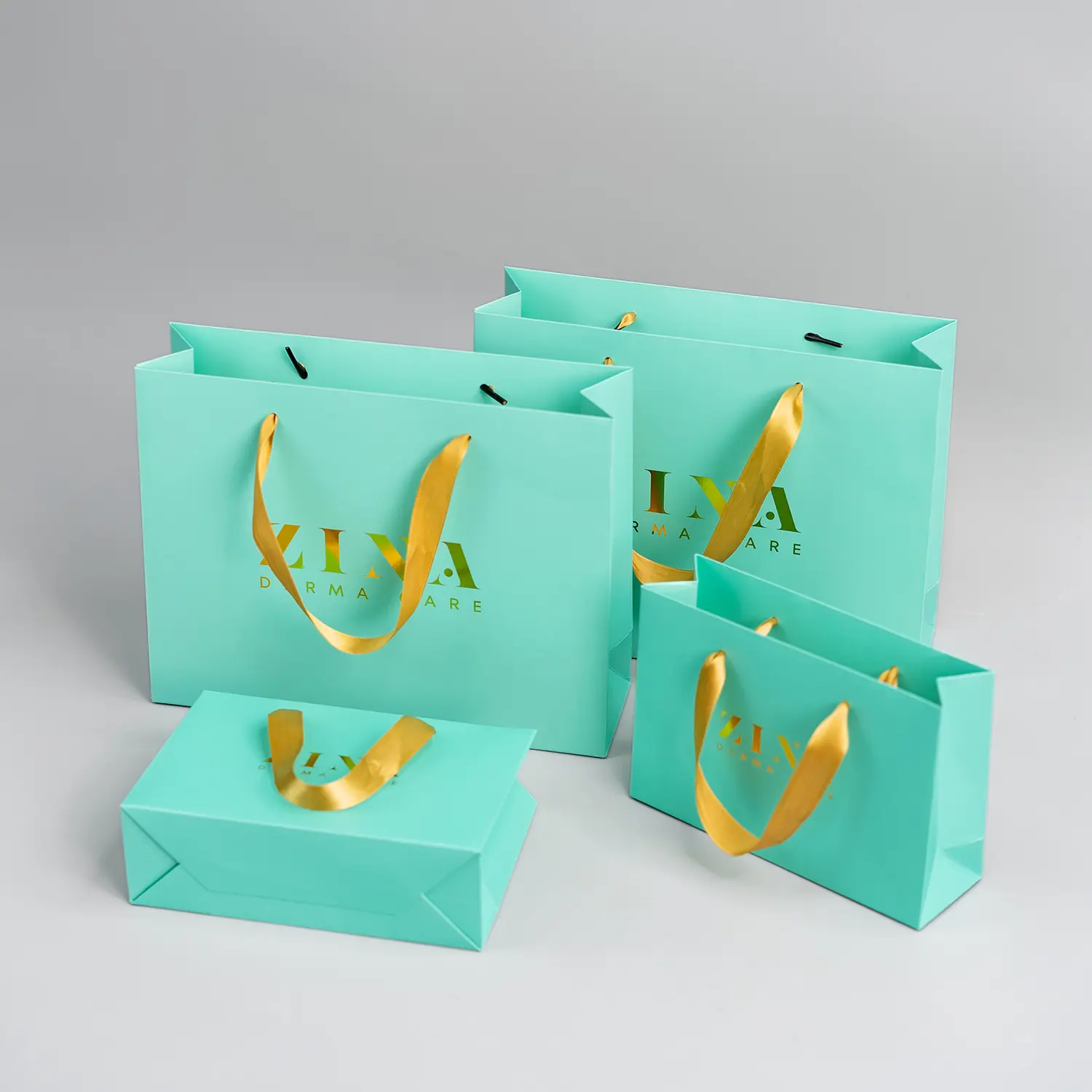 Fresh green gift paper bag with ribbon handle