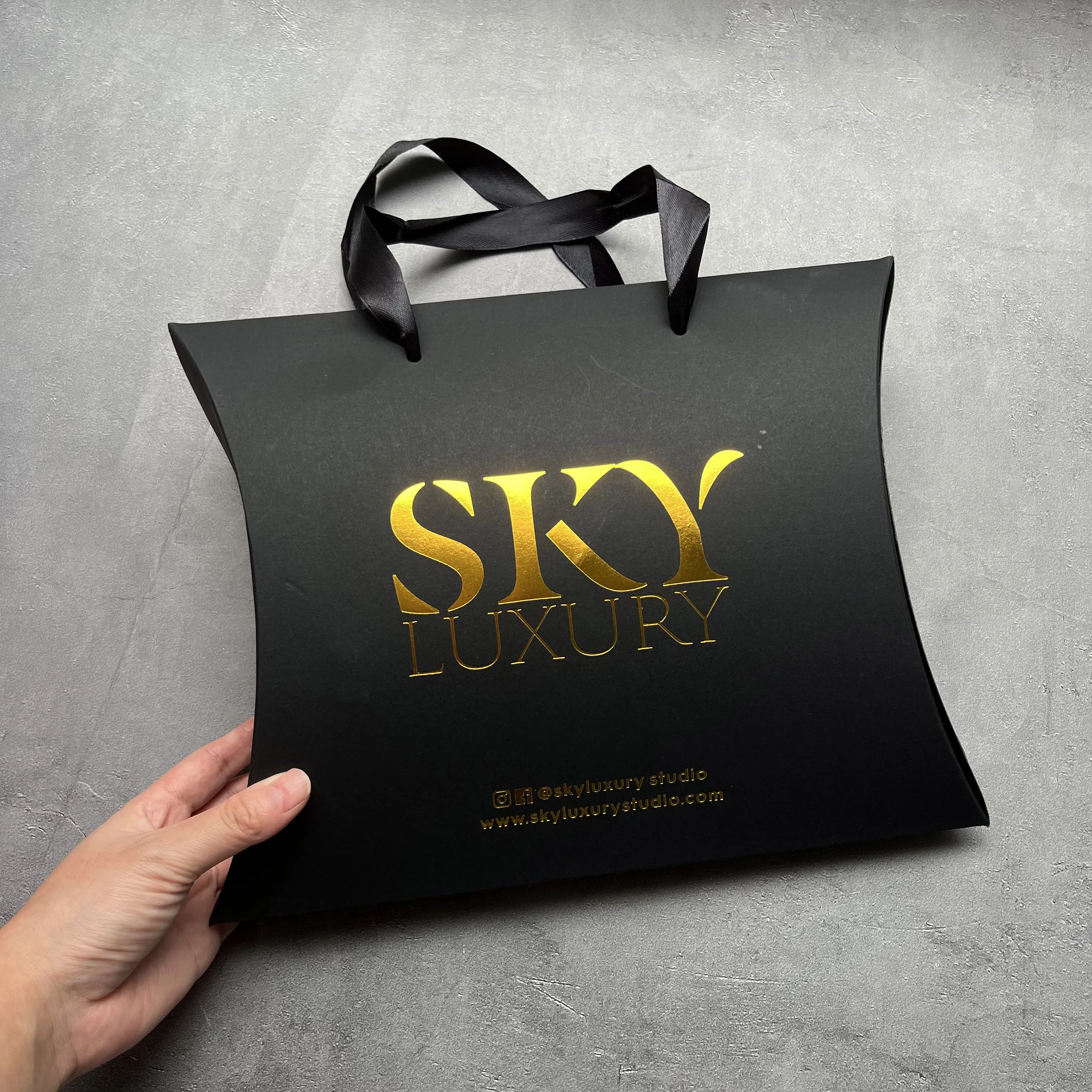 Black foil brand logo paper shopping bag