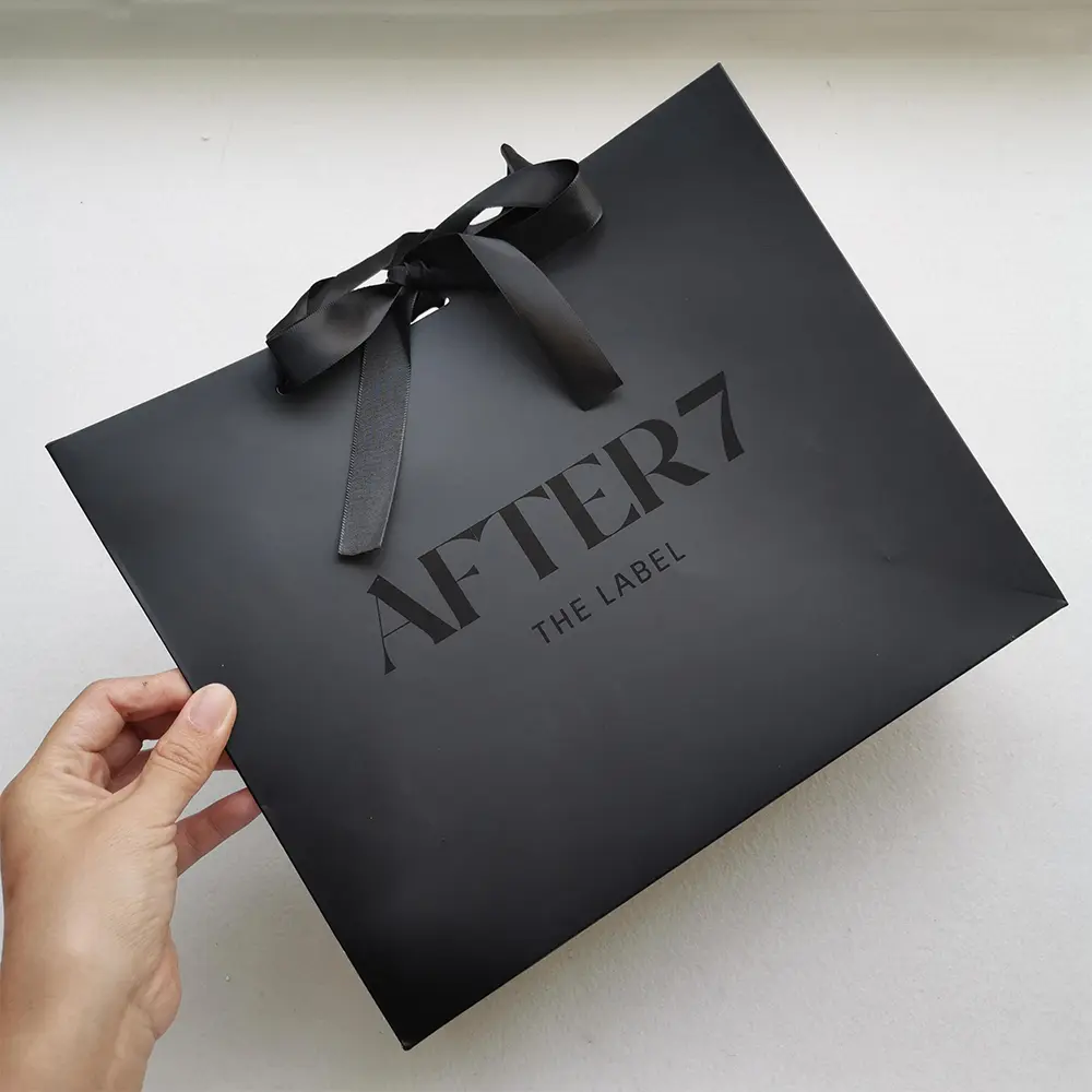 Luxury black paper bag with ribbon handle