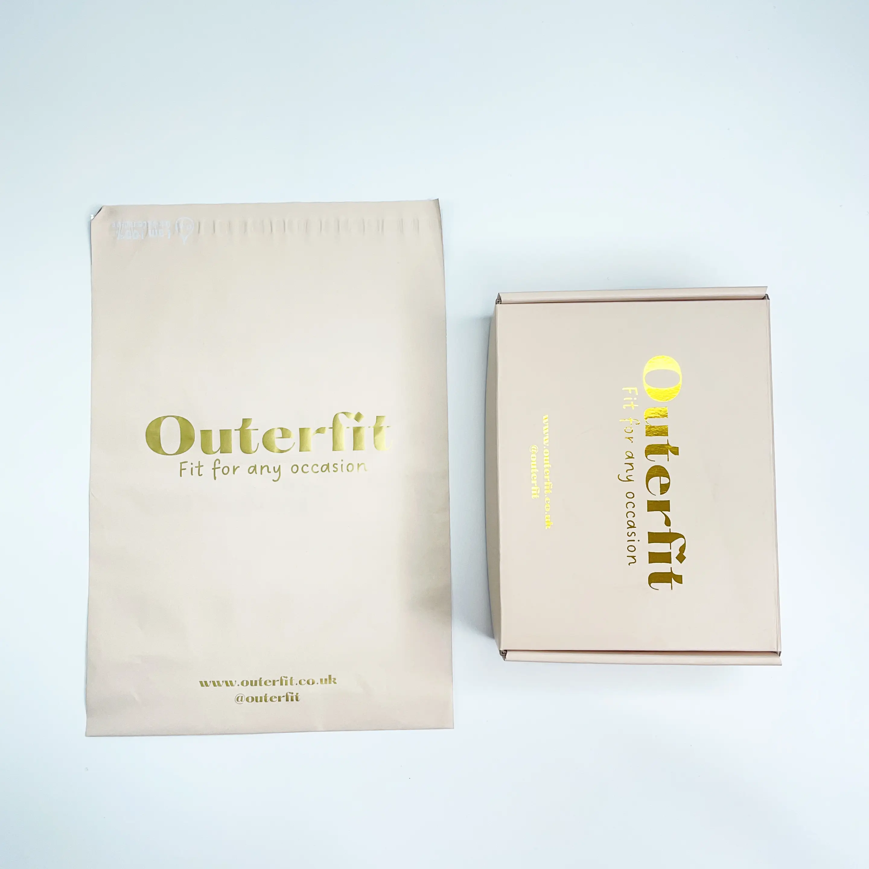 Peach paper mailer box with gold foil logo